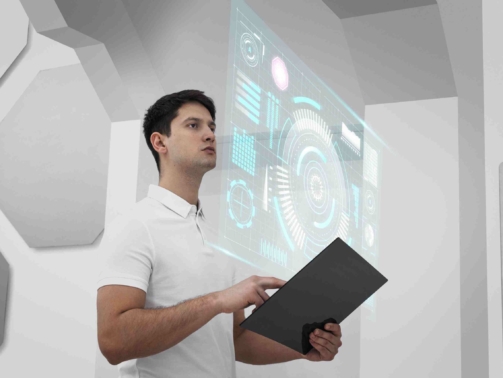 medium-shot-man-holding-device (1)